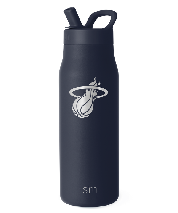This is a Simple Modern Miami HEAT Blue 34oz Engraved Bottle featuring a sleek matte black finish with the Miami Heat basketball logo engraved in white on the front. The bottle offers double-wall insulation to keep your drinks cold, a convenient handle, and a leakproof lid with a flip straw. The letters “SLM” appear at the base.