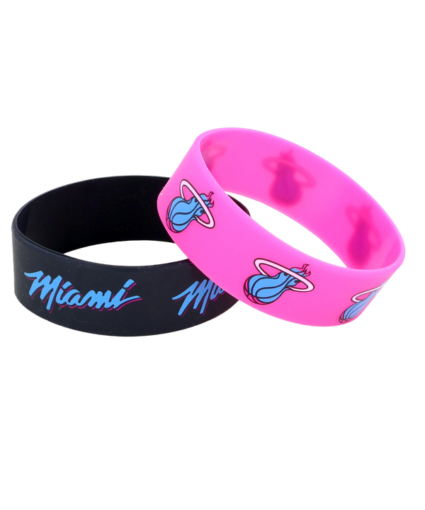 The Aminco Miami HEAT Original Vice Nights 2-Pack Bracelet features two officially licensed silicone wristbands: one black with Miami in blue and pink script, and one pink with a blue flaming basketball logo. One size fits most.