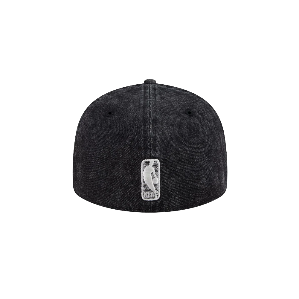 The New Era Miami HEAT 5950 Logo Fitted Hat is a black denim cap with a low profile, shown from the back. It features a small white embroidered NBA logo at the center, a rounded crown with visible stitching, and a classic curved visor.