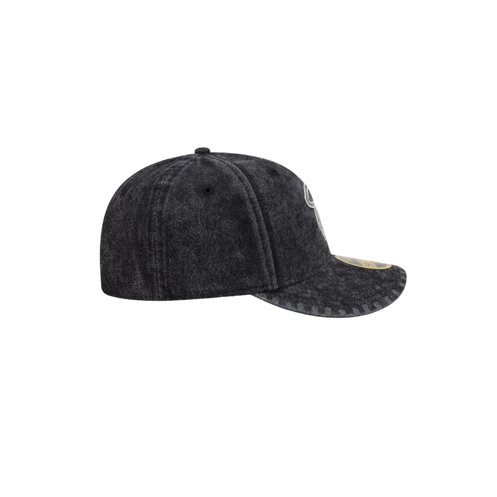 The New Era Miami HEAT 5950 Logo Fitted Hat by New Era is shown from the side with a curved visor and sticker on the brim, in black acid-wash, set against a plain white background.