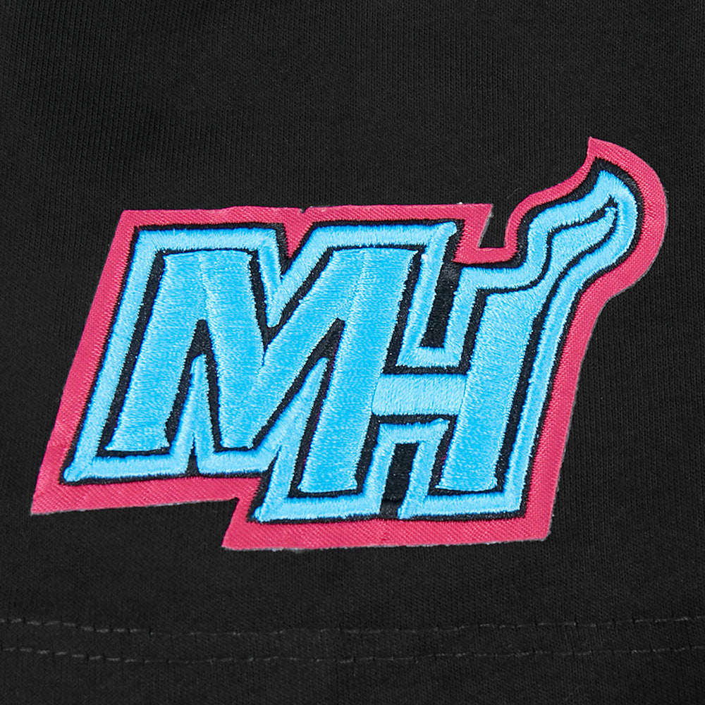 The Pro Standard Miami HEAT Original Vice Nights Graffiti Youth Tee features a black cotton relaxed fit with an embroidered logo—blue MH letters outlined in pink, the H’s top right forming a flame. Machine washable for easy care.