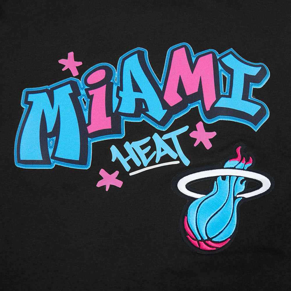 The Pro Standard Miami HEAT Original Vice Nights Graffiti Youth Tee features bold blue, pink, and white MIAMI HEAT text with pink stars and a flaming basketball logo on black cotton in a relaxed fit. Easy machine wash care.