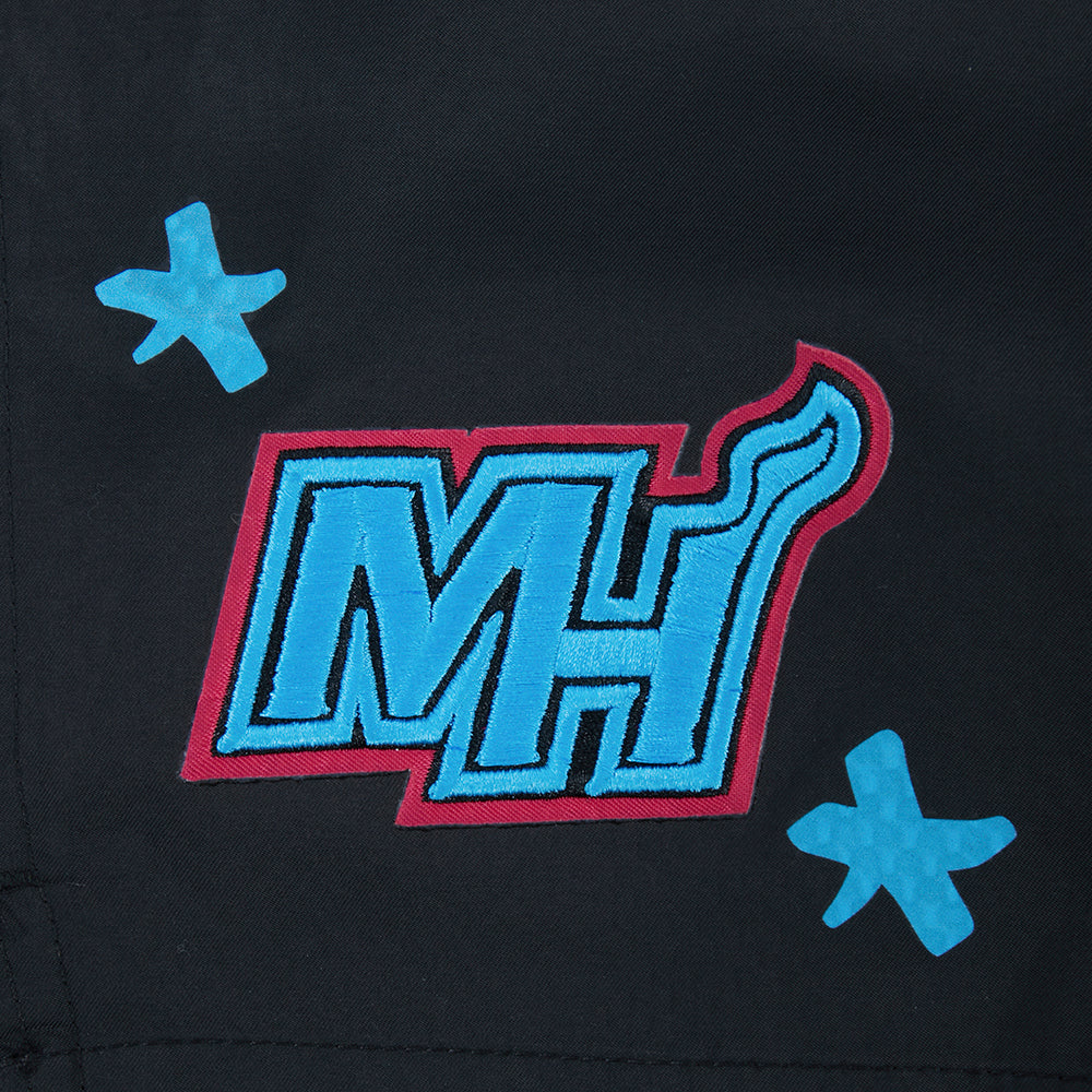 The Pro Standard Miami HEAT Original Vice Nights Youth Shorts feature a stylized blue and pink MH logo with unique details and star shapes on black, crafted in durable, machine-washable polyester—ideal for a relaxed fit.