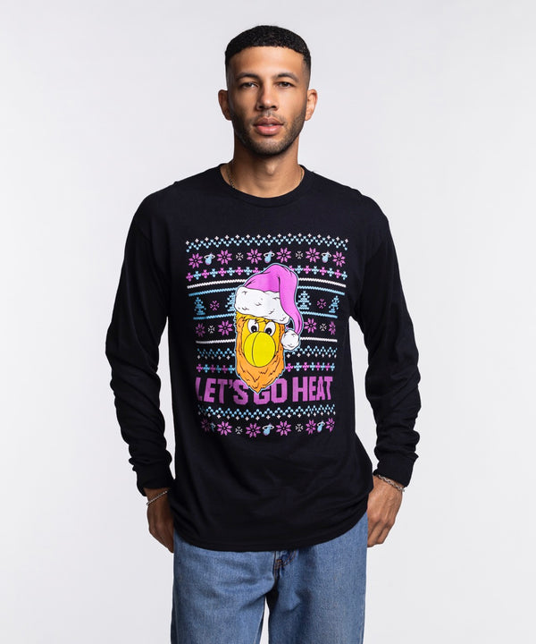 A man wears the Miami HEAT Original Vice Nights Burnie Holiday Long Sleeve Tee by Item Of The Game, featuring a cartoon bird in a purple Santa hat and 