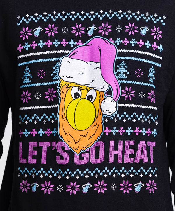 A man wears the Miami HEAT Original Vice Nights Burnie Holiday Long Sleeve Tee by Item Of The Game, featuring a cartoon bird in a purple Santa hat and 