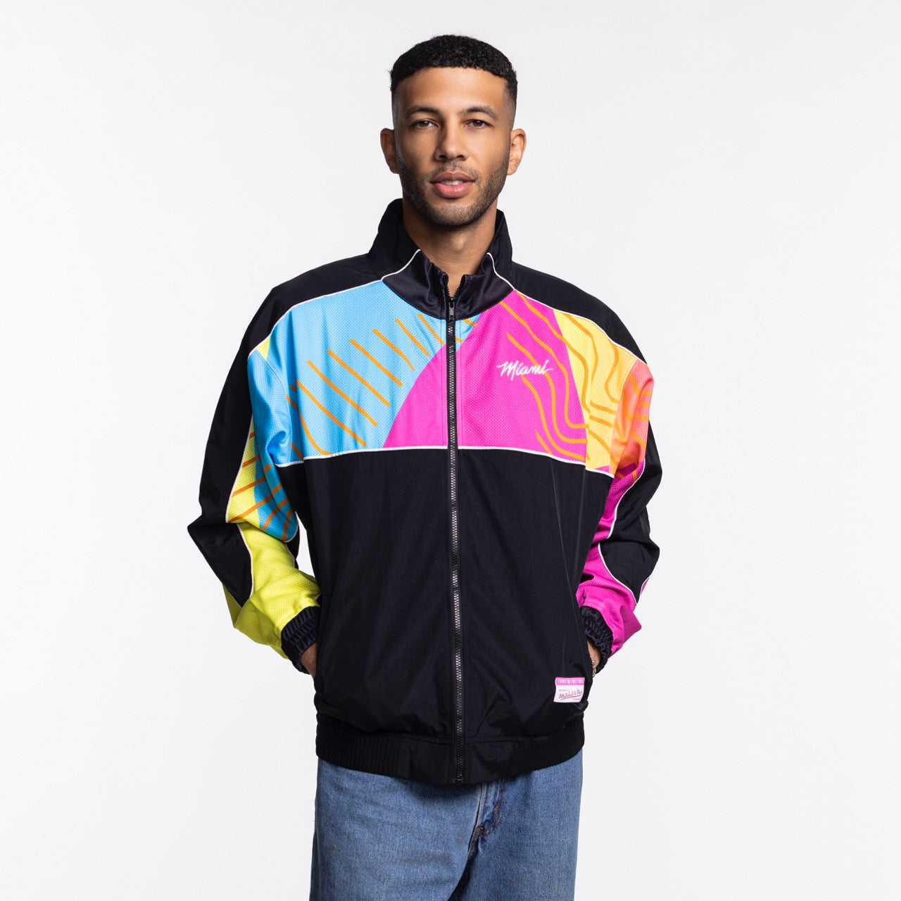 A man faces the camera in a Court Culture x Mitchell & Ness Original Vice Nights 