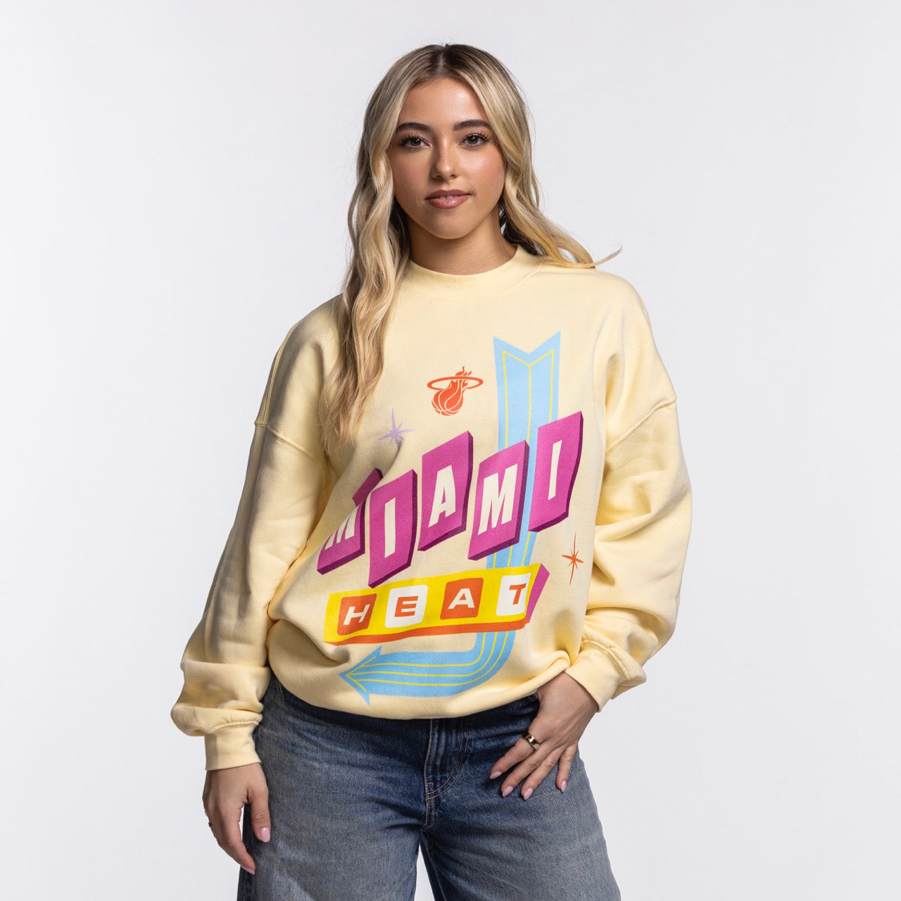 A woman with long blonde hair wears a Court Culture Original Vice Nights 