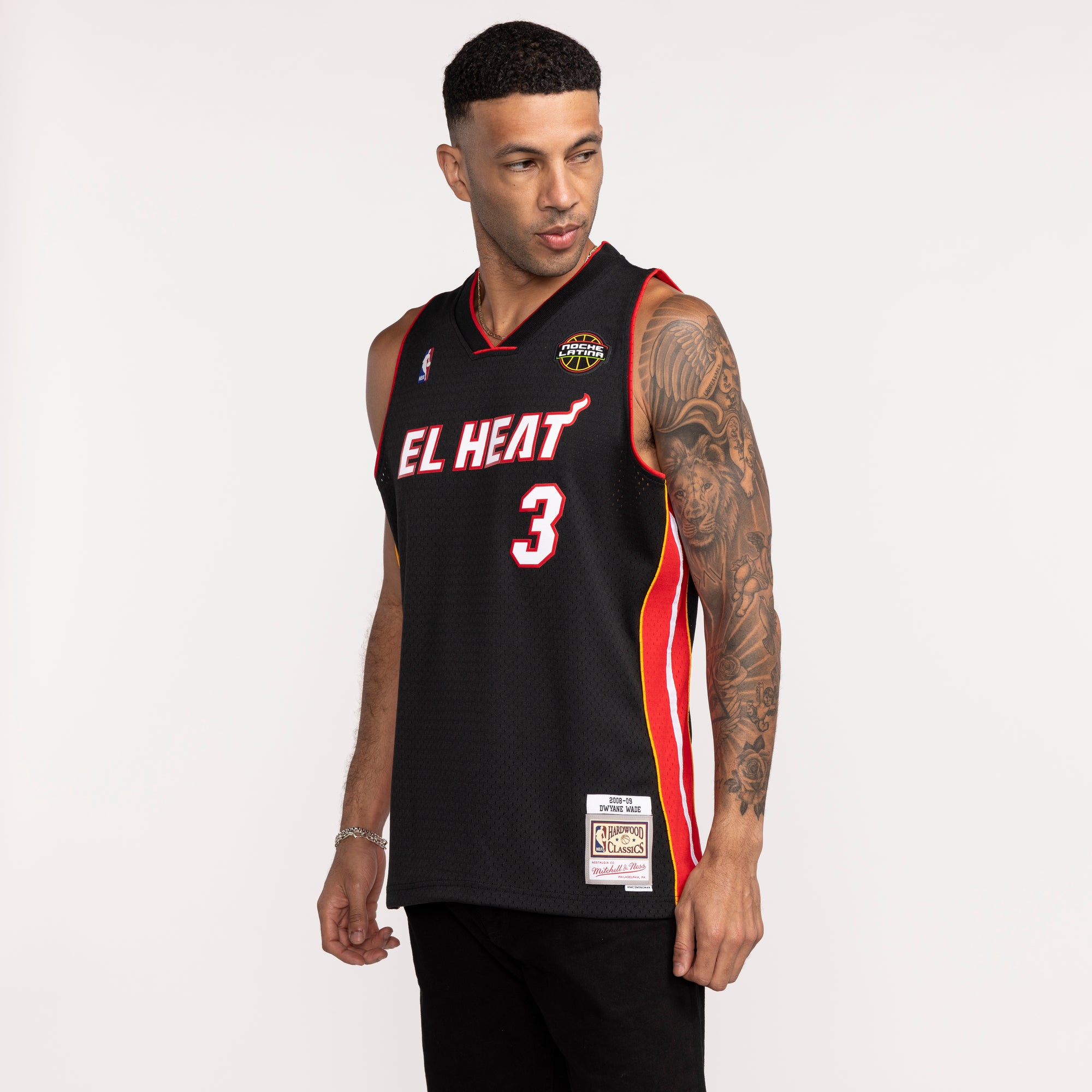 Black Dwyane Wade Miami HEAT swingman jersey with red and white accents, number 3. - Dwyane Wade Mitchell & Ness 2008-09 EL HEAT Swingman Jersey