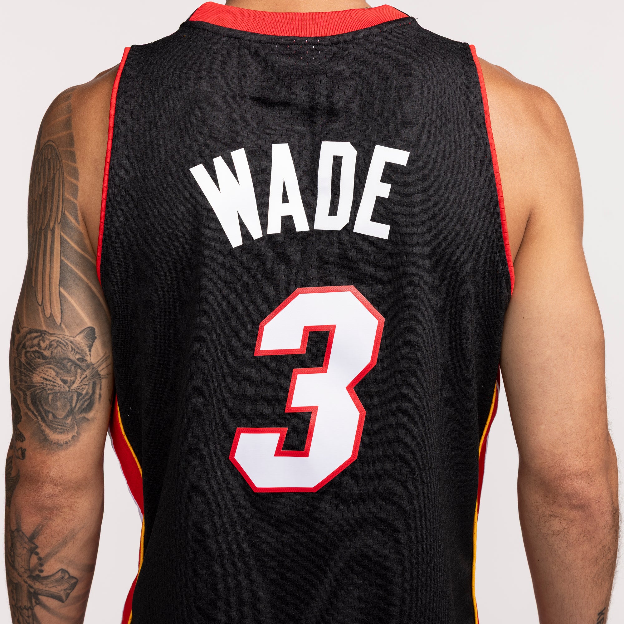 Black Mitchell & Ness Miami HEAT swingman jersey with Wade 3 in white and red accents. - Dwyane Wade Mitchell & Ness 2008-09 EL HEAT Swingman Jersey