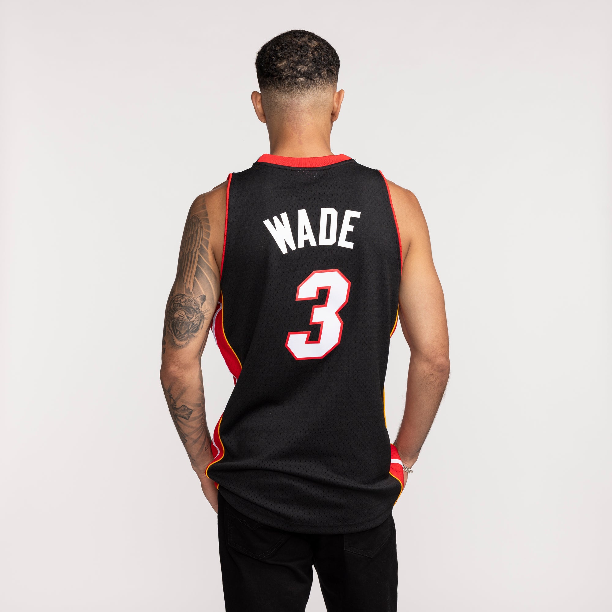 Black Miami HEAT swingman jersey with red trim, 
