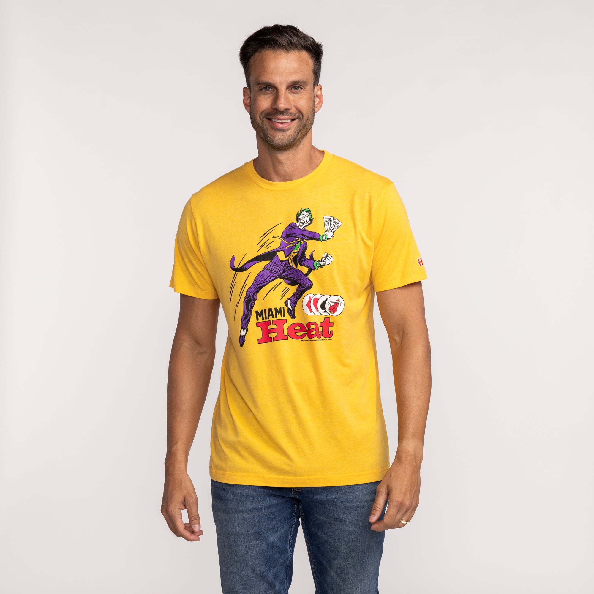 Yellow Homage Miami HEAT short-sleeve tee with Joker graphic and team logo on front. - Homage Miami HEAT Joker Tee