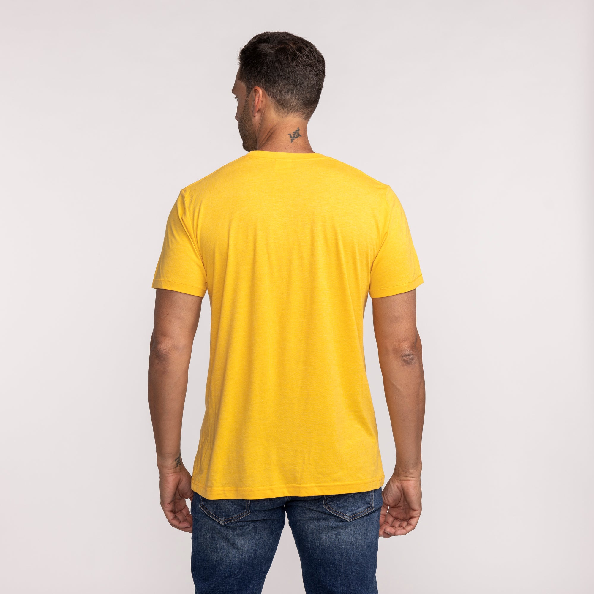 Yellow short-sleeve Homage Miami HEAT Joker tee shown from back on male model. - Homage Miami HEAT Joker Tee