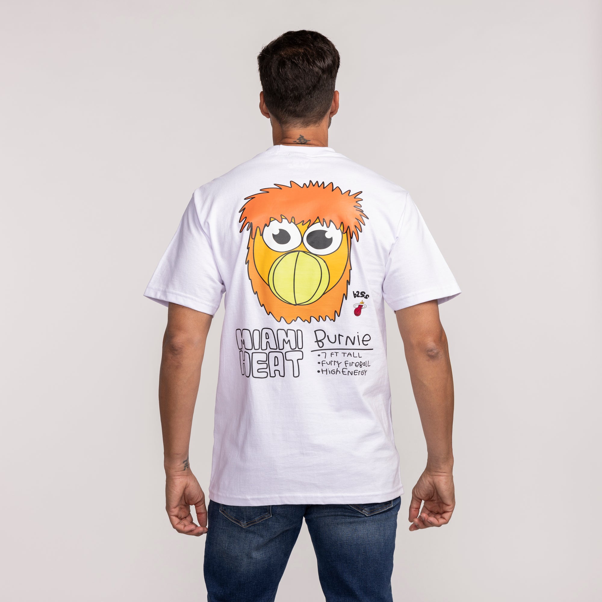 White short-sleeve tee featuring colorful Miami HEAT graphic with cartoon bird and bold text on back. - B2SS Miami HEAT Get Loud Tee