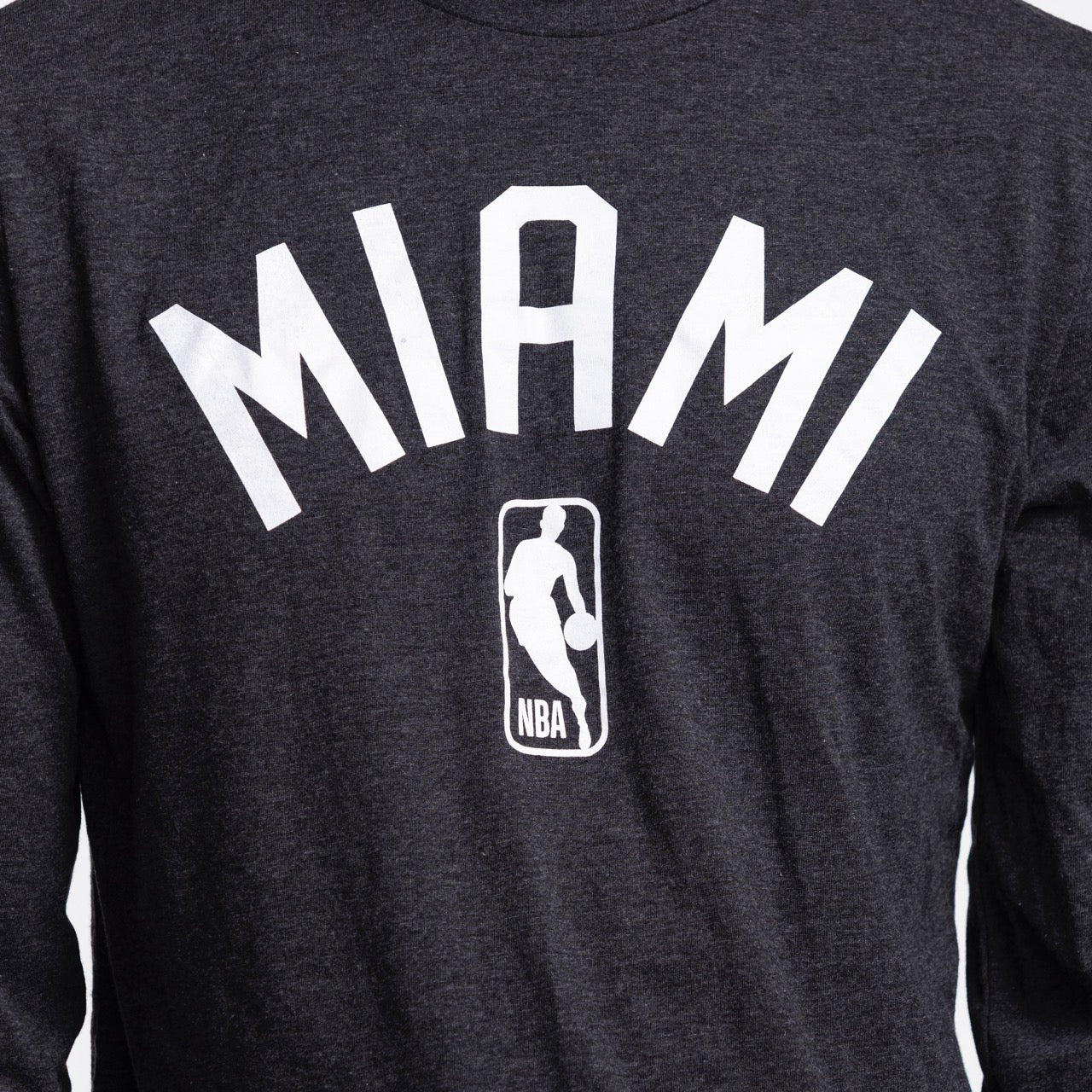 A close-up of the Sportiqe Miami HEAT NBA Long Sleeve Tee by Sportiqe, a standard fit shirt featuring 