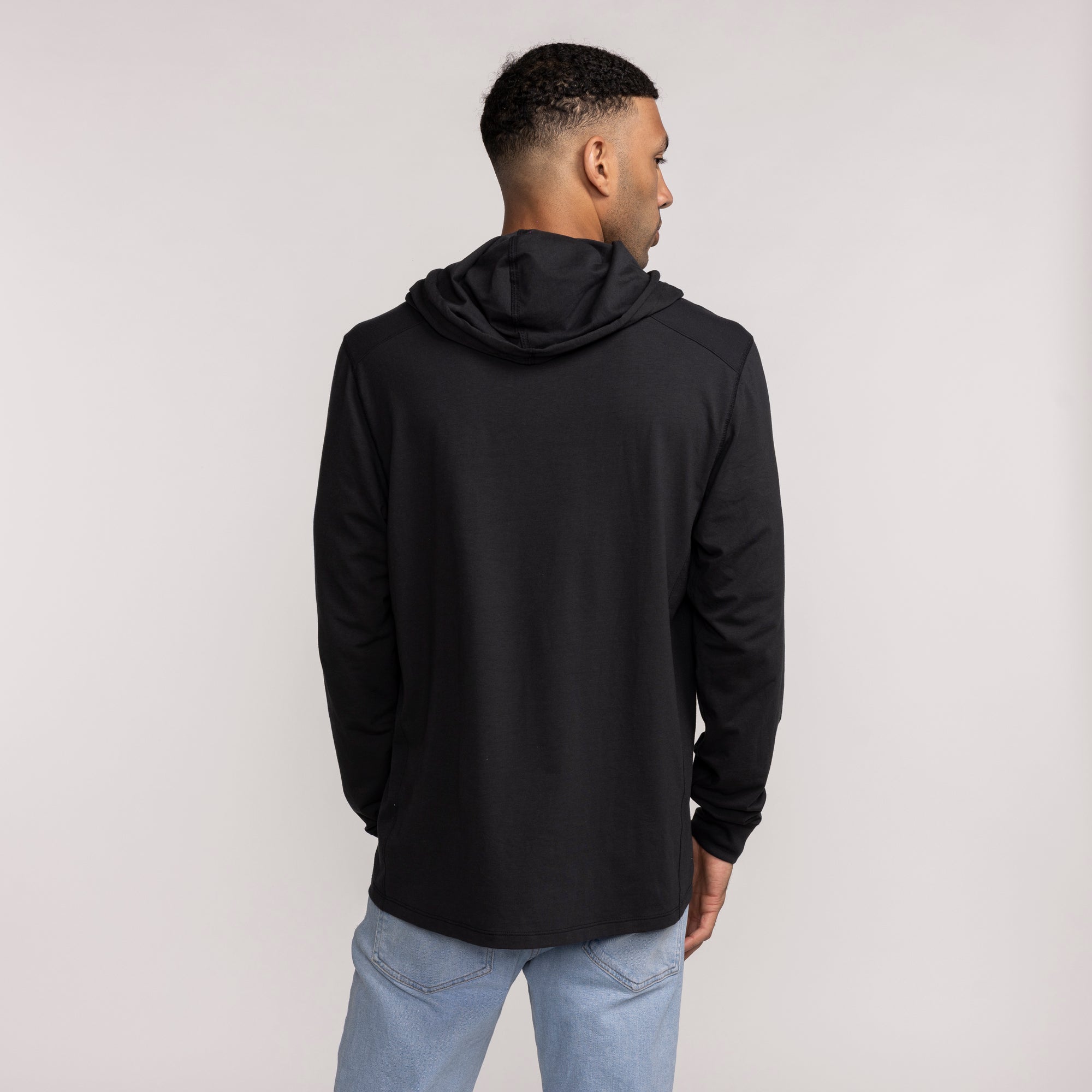 Black 47 Brand hoodie with hood up, displayed from the back, featuring long sleeves and a relaxed fit. - '47 Brand Miami HEAT Logo Forward Hoodie