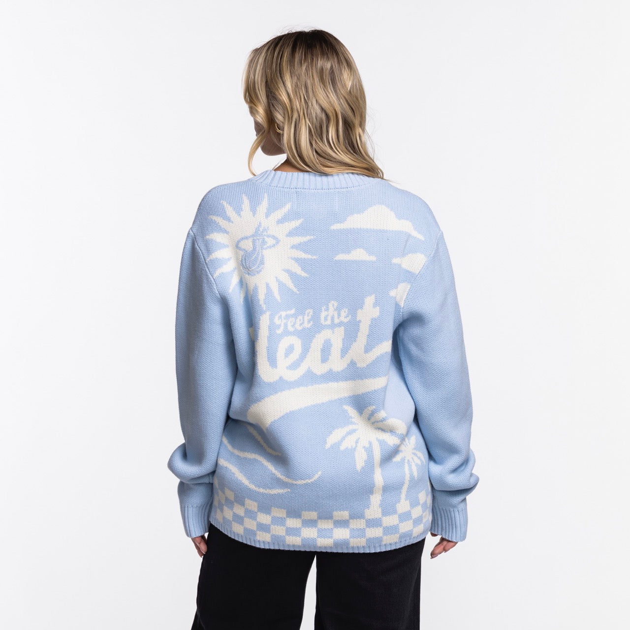 A person with wavy blonde hair, seen from behind, wears the Court Culture X The Wild Collective Original Vice Nights 