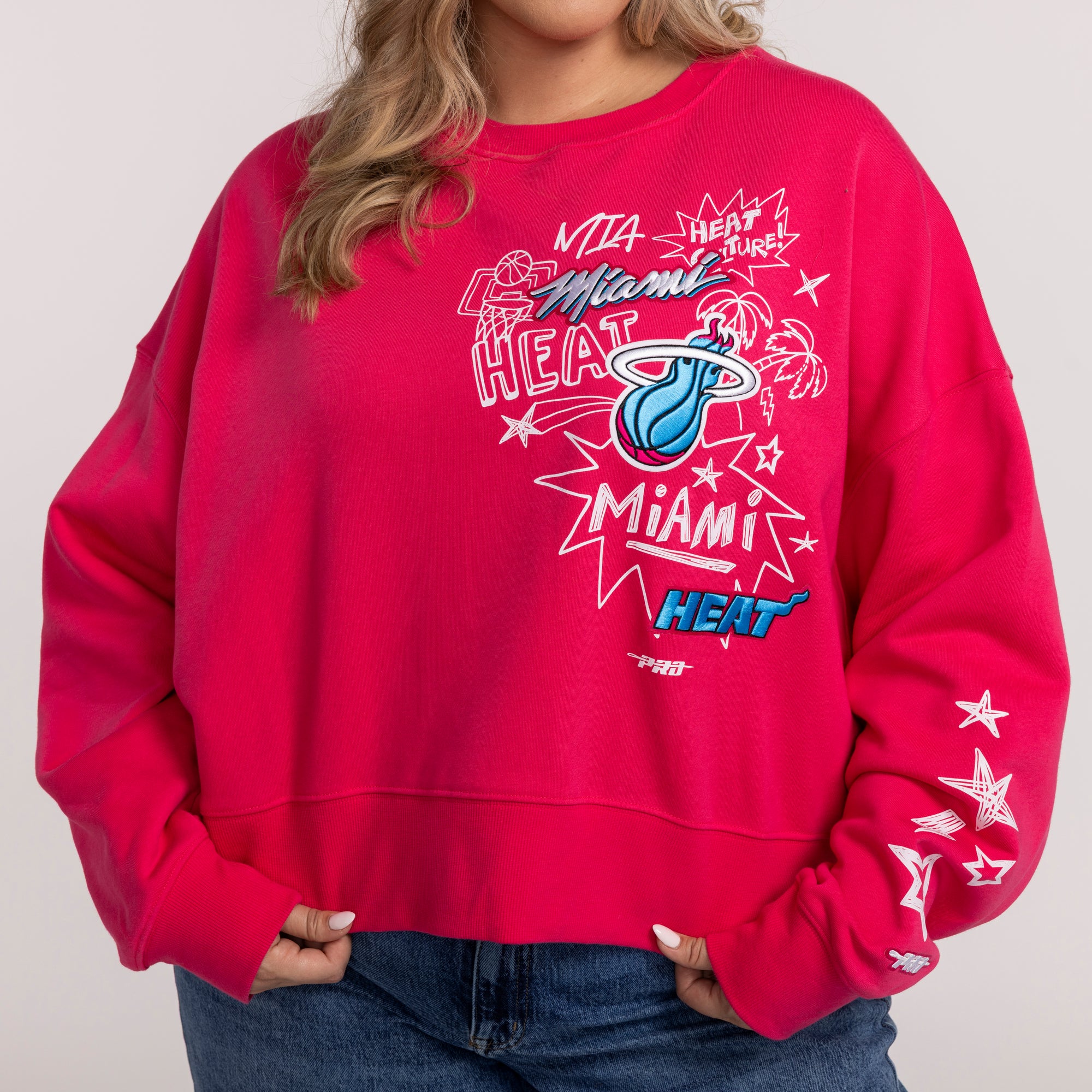 Pink women's crewneck sweatshirt with colorful Miami HEAT graphic and star details on sleeves. - Pro Standard Miami HEAT Original Vice Pink Women's Crewneck
