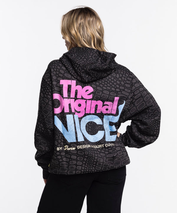 A man wears the Court Culture x Duvin Original Vice Hoodie—a black, geometric-patterned hoodie with 