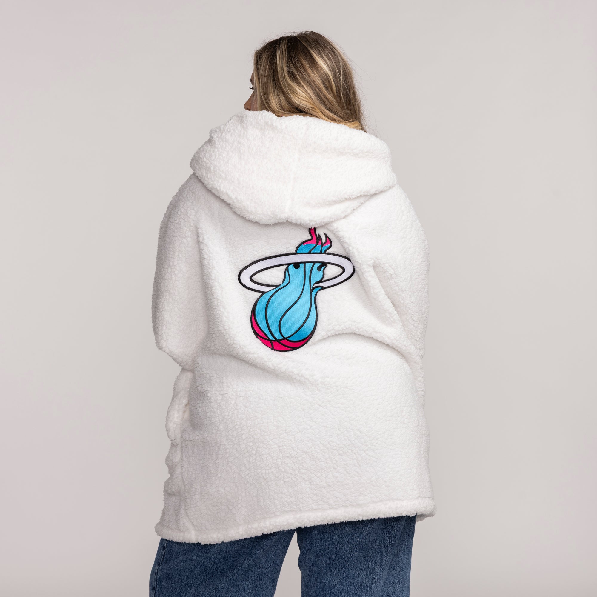 White plush hoodie with oversized Miami HEAT logo in blue and pink on back. - Jill Martin Miami HEAT Original Vice Lounger Plush