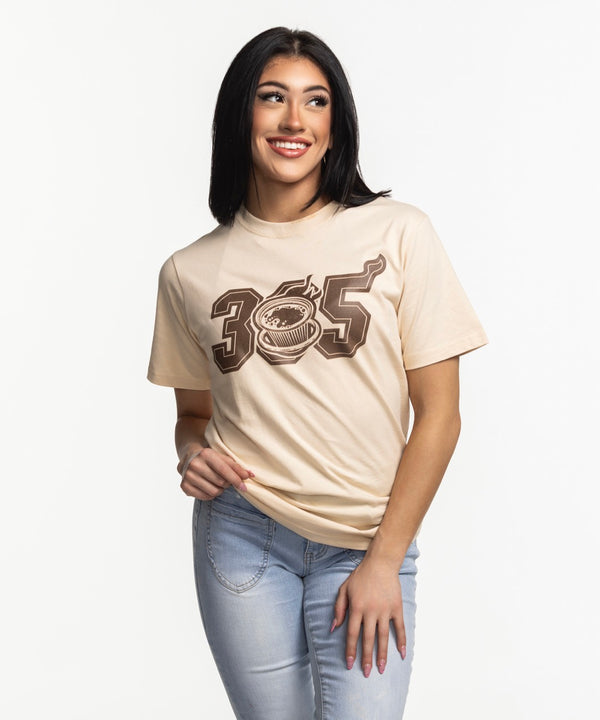 A man in the Court Culture 305 Cafecito Unisex Tee—a beige, 100% cotton shirt with a coffee cup and 