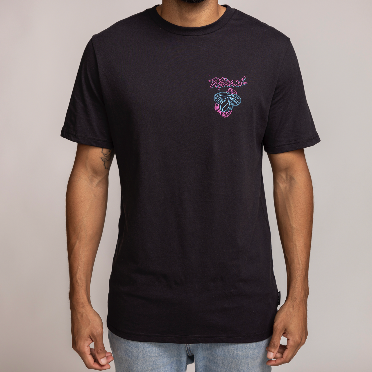 Black short-sleeve Miami HEAT Original Vice Venue T-shirt with pink and blue logo on left chest. - Stadium Essentials Miami HEAT Original Vice Venue Tee