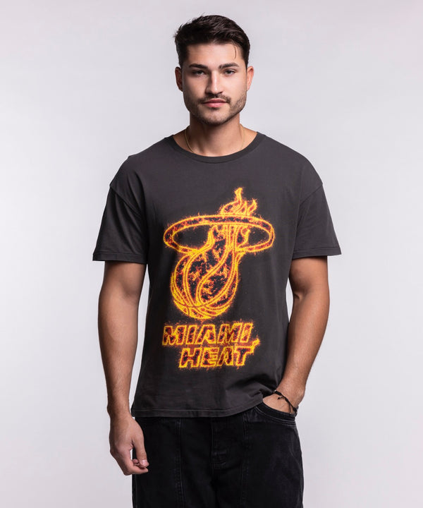 A man with short hair and a trimmed beard stands facing forward, wearing the Court Culture 