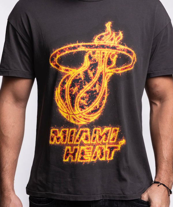 A man with short hair and a trimmed beard stands facing forward, wearing the Court Culture 