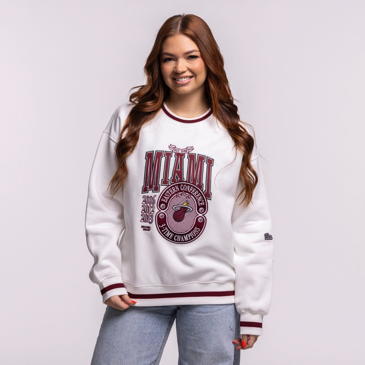 A young woman with long brown hair wears the Court Culture 