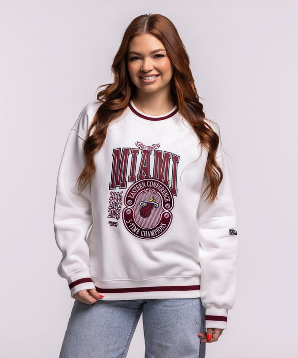 A man smiles against a plain light background wearing the Court Culture 