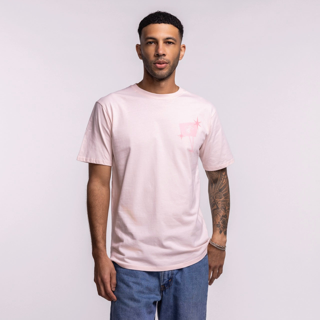 A man with short dark hair and a tattoo on his left forearm wears the Court Culture Original Vice Nights 