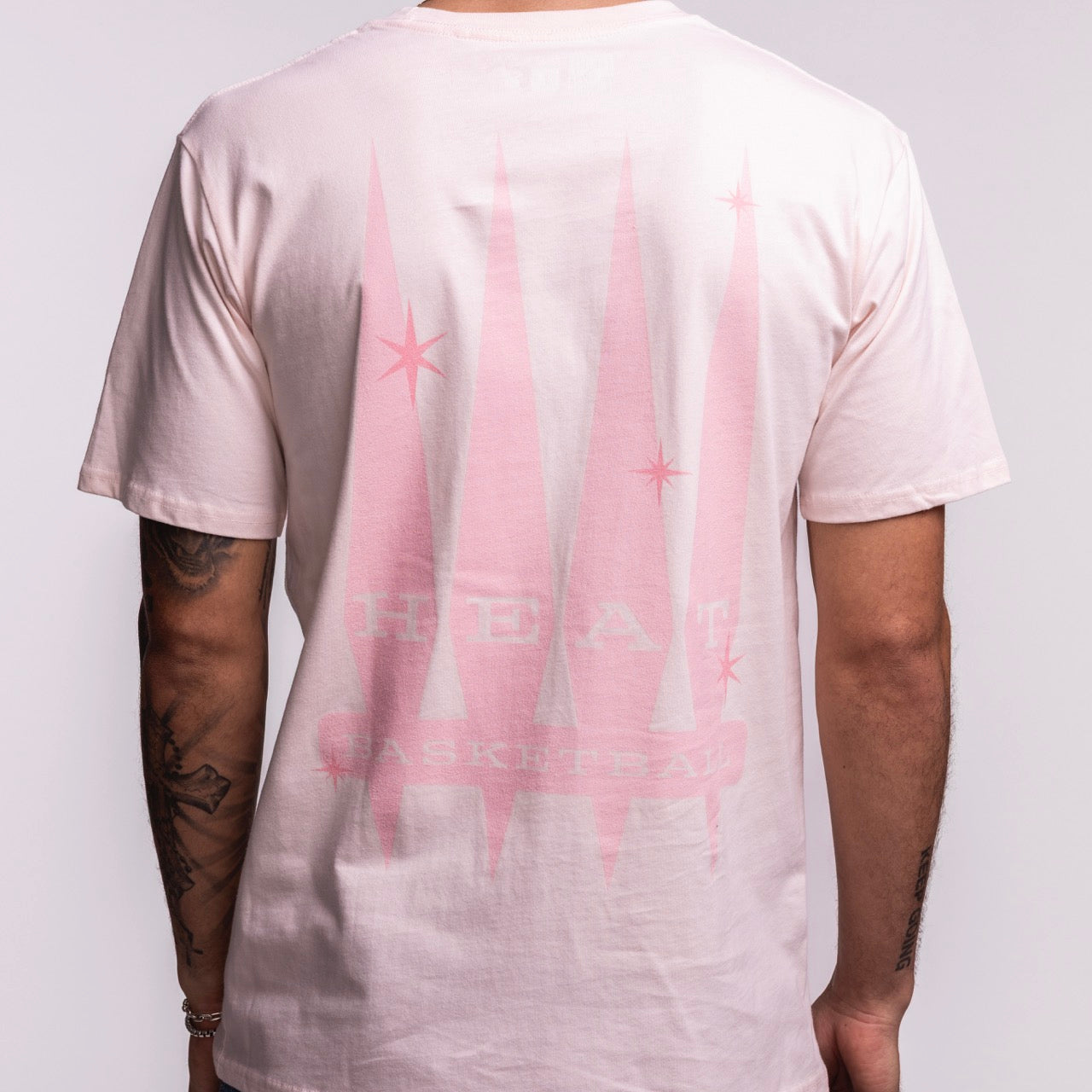 A tattooed person wears the Court Culture Original Vice Nights 