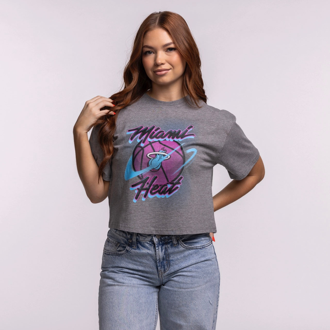 A woman with long auburn hair models the Court Culture Original Vice Nights 