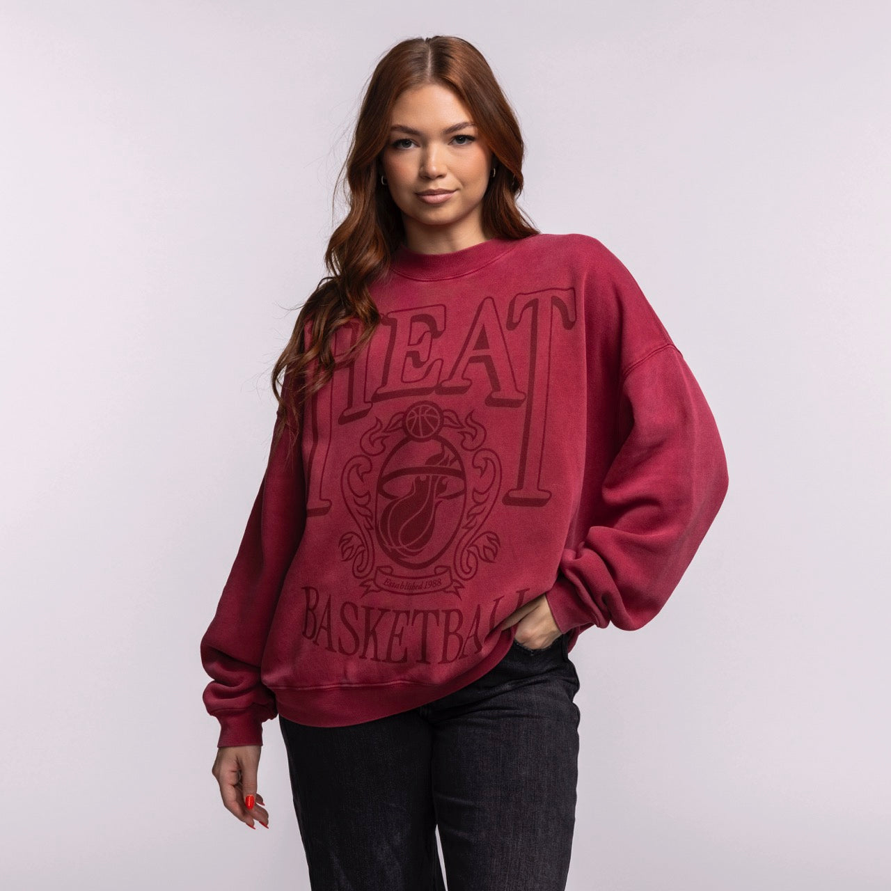 A woman with long brown hair wears the Court Culture 