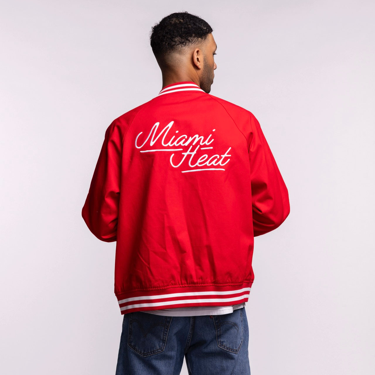 A person faces away, wearing the Court Culture 