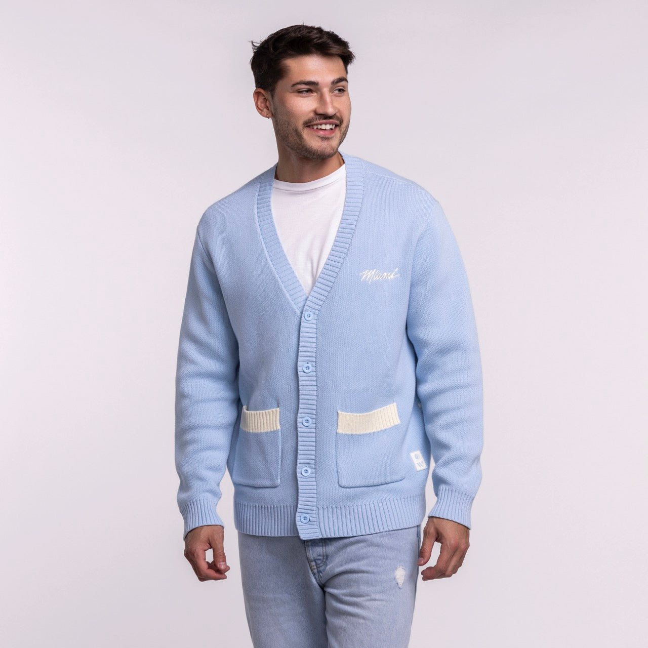 A man smiles, looking to the side, wearing the Court Culture X The Wild Collective Original Vice Nights 