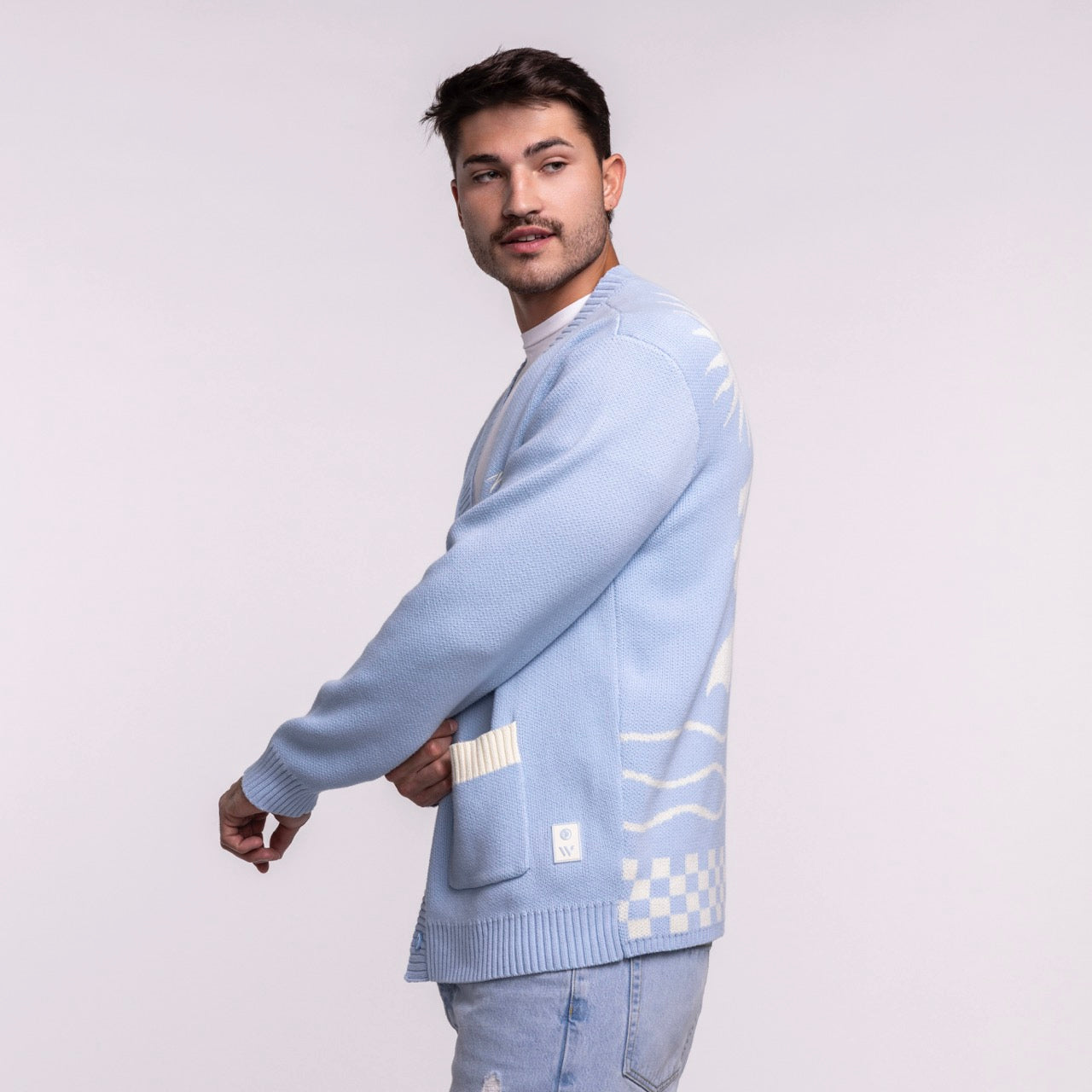 A man with short dark hair and a mustache models the Court Culture X The Wild Collective Original Vice Nights 