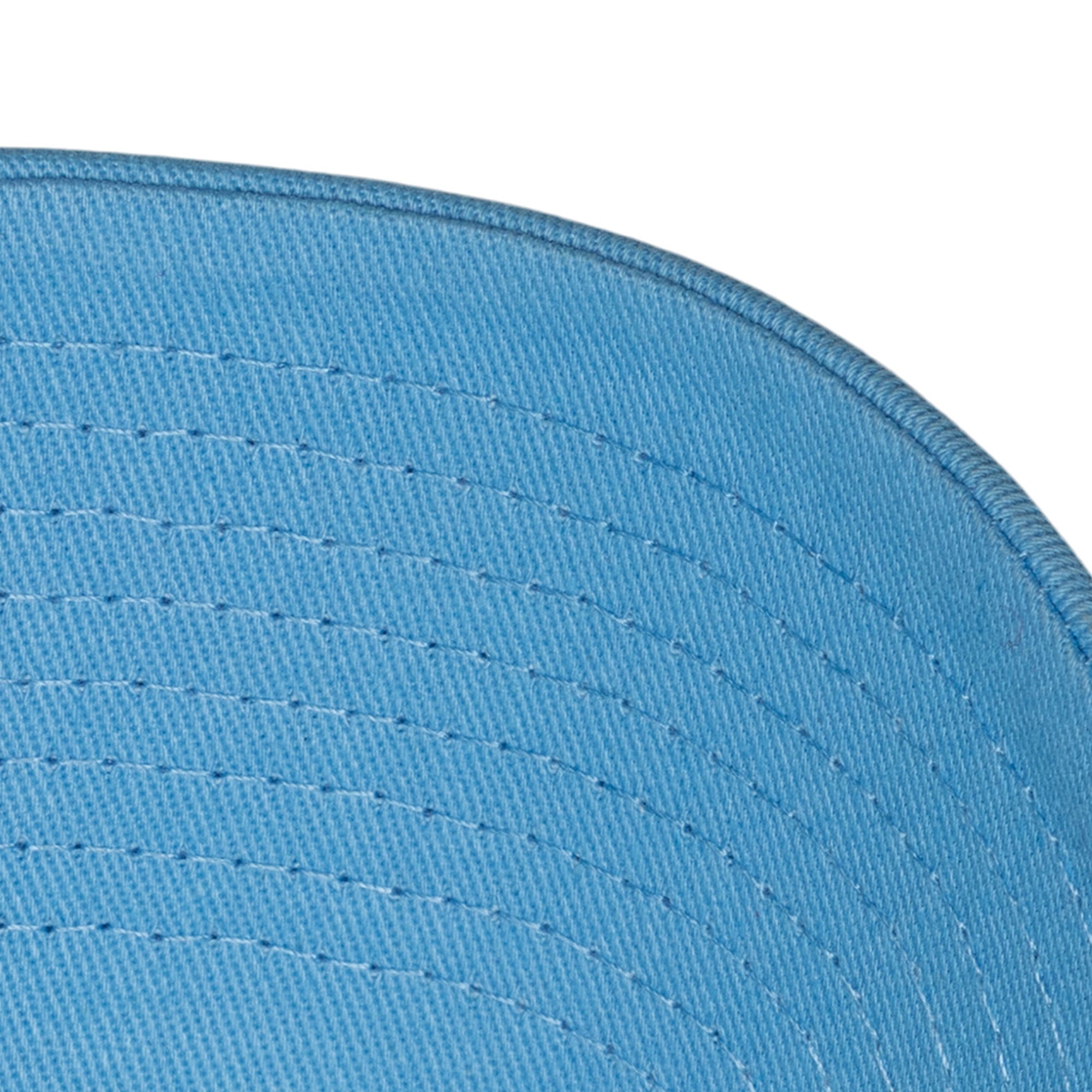 Close-up view of the underside of the Mitchell & Ness Miami HEAT Blue Logo Adjustable Hat’s brim, highlighting detailed stitching and fabric texture. This one size fits most cap by Mitchell & Ness is great for everyday wear.