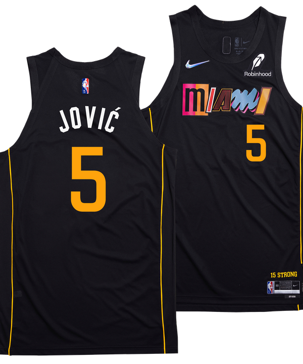 The image shows two black Nikola Jović Nike Miami HEAT Mashup Swingman Jerseys with yellow trim and the number 5, featuring 