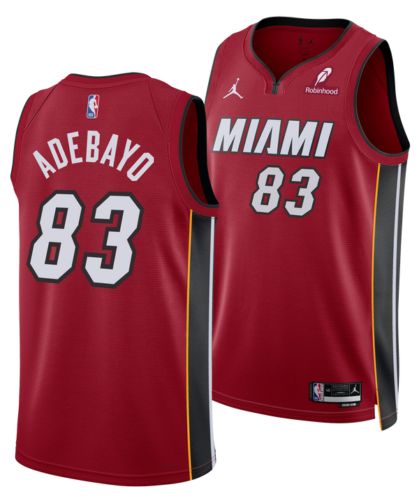 The Nike Bam Adebayo Jordan Brand Miami HEAT Statement Red “83-Point Game” Swingman Jersey features Dri-FIT comfort, white/black accents, NBA and Jordan logos, Robinhood sponsor, and Adebayo’s name with number 83 on the back.