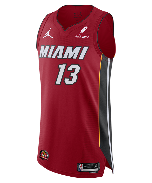 The Bam Adebayo Nike Jordan Brand Miami HEAT Statement Red Authentic Jersey features the number 13 in white, black and yellow side panels, Jordan and Robinhood logos, plus NBA, Miami Heat, and 2006 Championship patch near the hem.