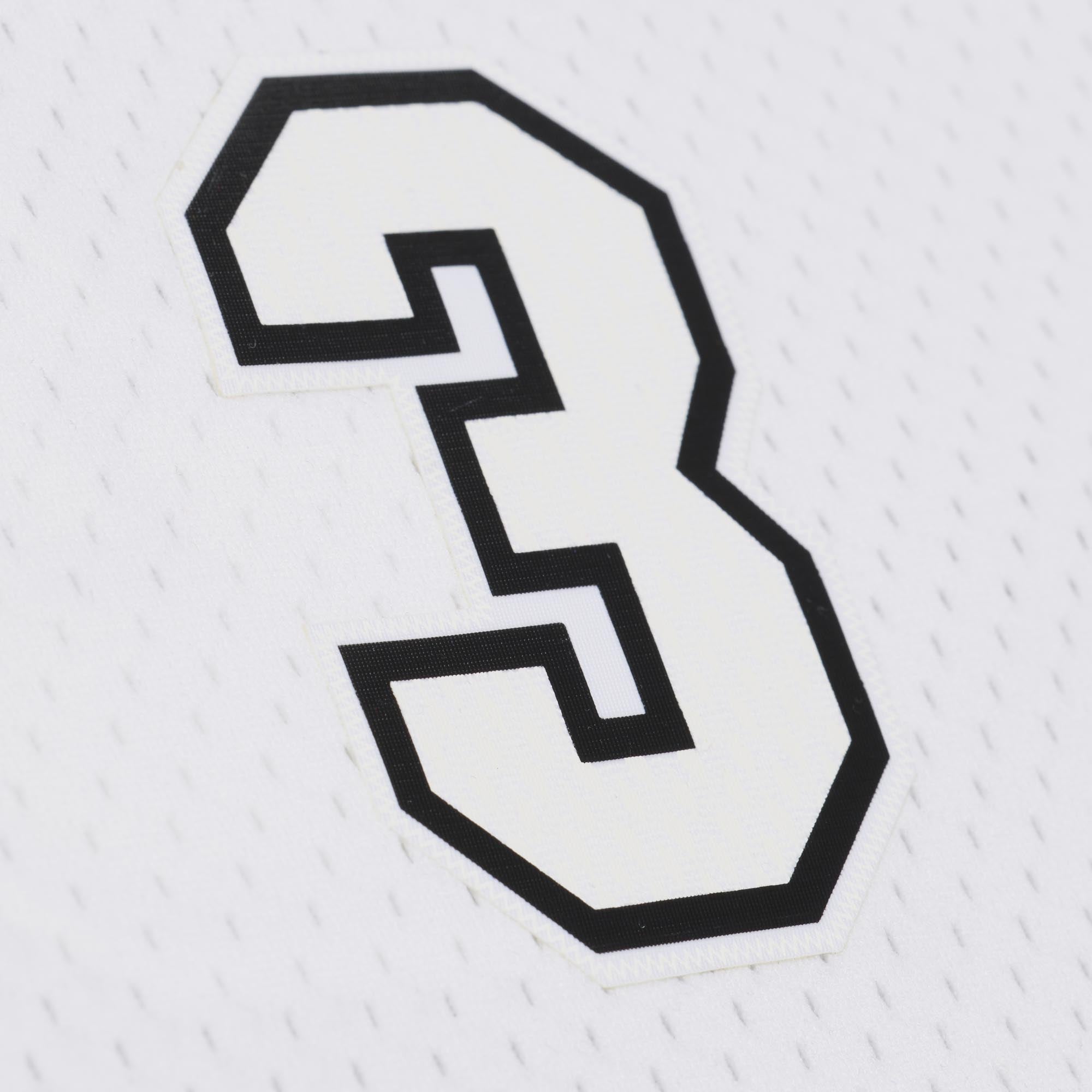 Close-up of a white Dwyane Wade Mitchell & Ness Miami HEAT White Hot 2012-13 Swingman Jersey featuring the number 3 in white with a thick black outline and a woven jock tag.