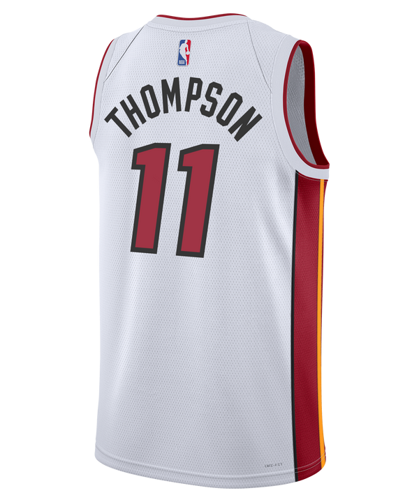 The Klay Thompson Nike Miami HEAT Association White Swingman Jersey by Nike features bold red “HEAT” lettering and number 11 on the front, crafted with durable heat-applied twill. This jersey includes red side panels and displays the Nike, Robinhood, and NBA logos on a clean white background. Enhanced with advanced Dri-FIT technology, it helps keep you cool and comfortable.