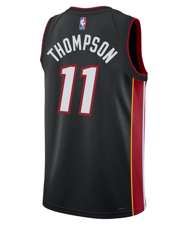 The Klay Thompson Nike Miami HEAT Icon Black Swingman Jersey features bold red and white “MIAMI” lettering, the number 11, Nike and Robinhood logos, and vibrant yellow-red side stripes. Made with Dri-FIT technology for superior comfort, this authentic Nike jersey showcases true team details and is presented against a plain white background.