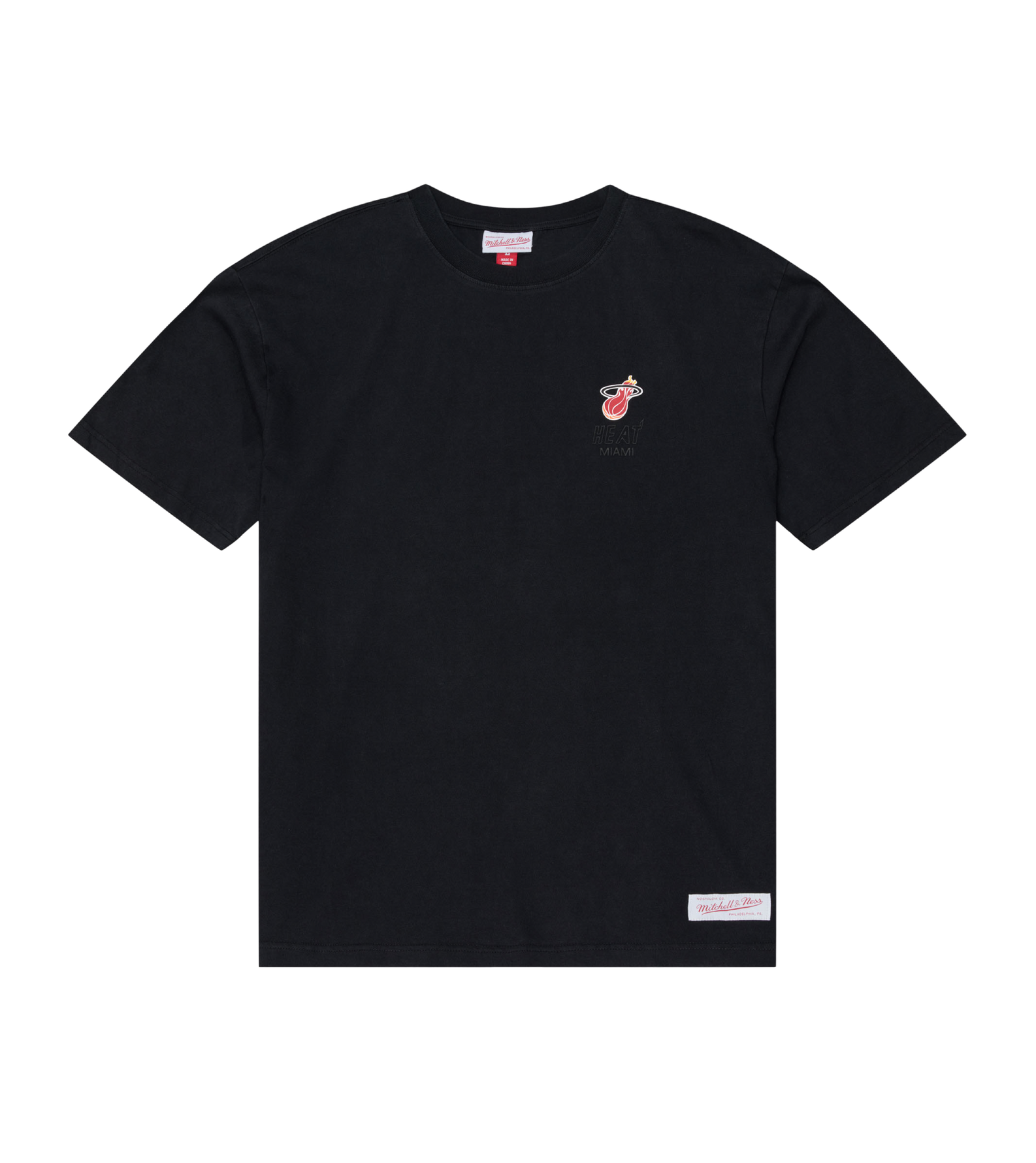 The Mitchell & Ness Miami HEAT Core Essential Tee by Mitchell & Ness features a black short-sleeve design with a small team graphic logo on the left chest and a rectangular label near the bottom hem. The T-shirt is laid flat on a white background.