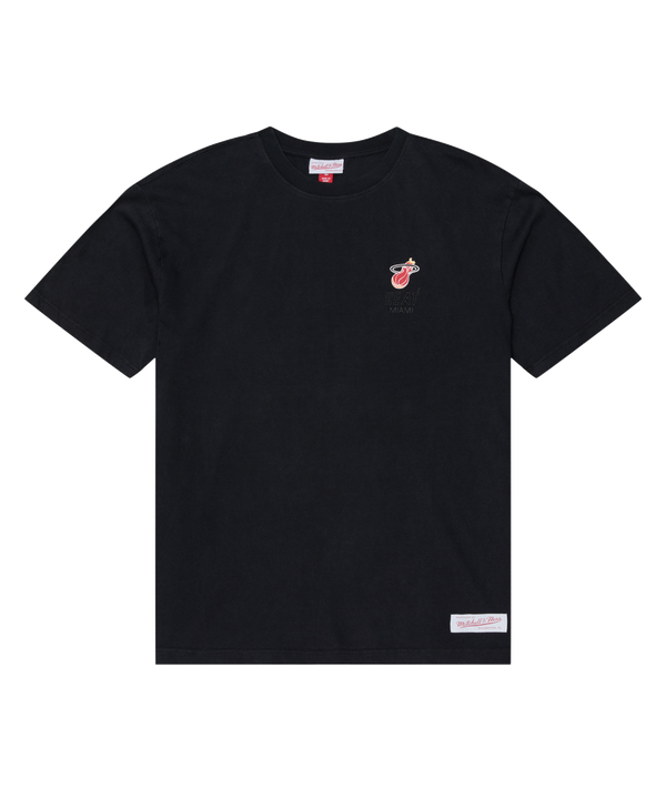 The Mitchell & Ness Miami HEAT Core Essential Tee by Mitchell & Ness features a black short-sleeve design with a small team graphic logo on the left chest and a rectangular label near the bottom hem. The T-shirt is laid flat on a white background.