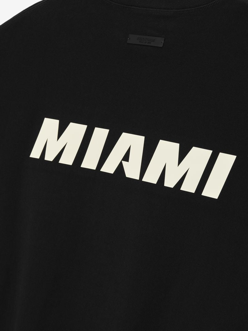 The Essentials Miami HEAT Fear of God Tee by Fear Of God is a black 90s-inspired oversized cotton heavy jersey shirt featuring bold white 