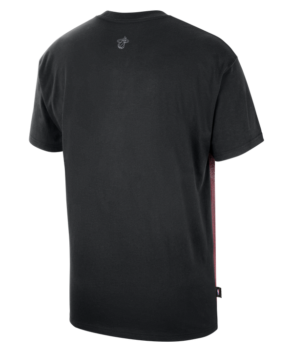 The Nike Miami HEAT Oversized Logo Game Tee is a black cotton t-shirt from Nike, featuring a loose fit with a white swoosh logo and a bold red, gray, and yellow graphic across the front inspired by the Miami HEAT basketball team logo.