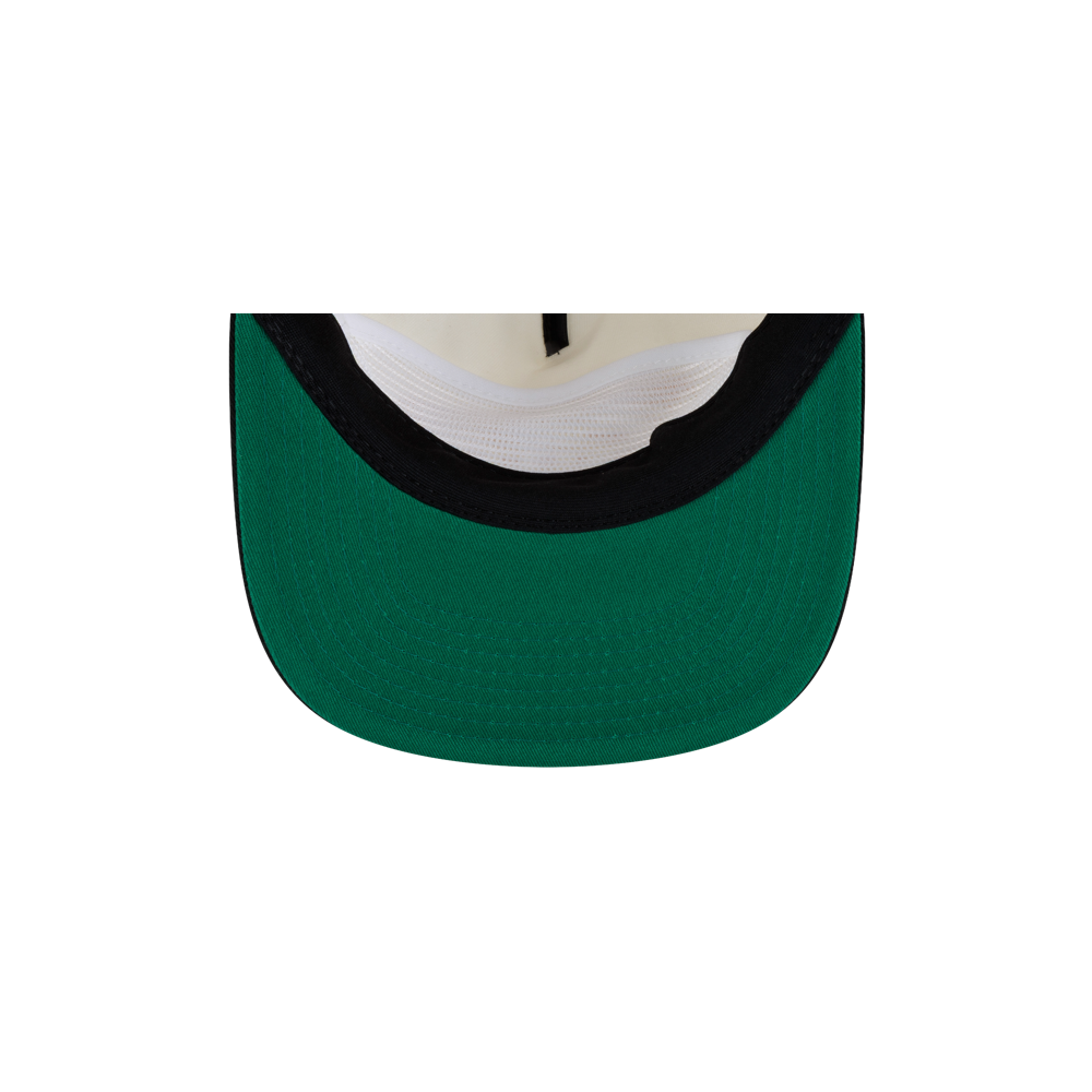 Underside of a Court Culture x New Era Facade Snapback, showing a green brim and a white mesh interior crown.