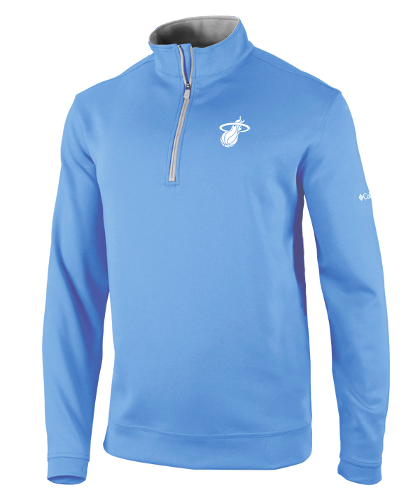 The Columbia Miami HEAT Original Vice Nights Women's Jacket by Columbia Outdoor is a light blue, long-sleeve quarter-zip with a relaxed fit, Miami Heat logo on the chest, Columbia logo on the sleeve, and gray inside collar. Polyester-spandex; machine wash cold.