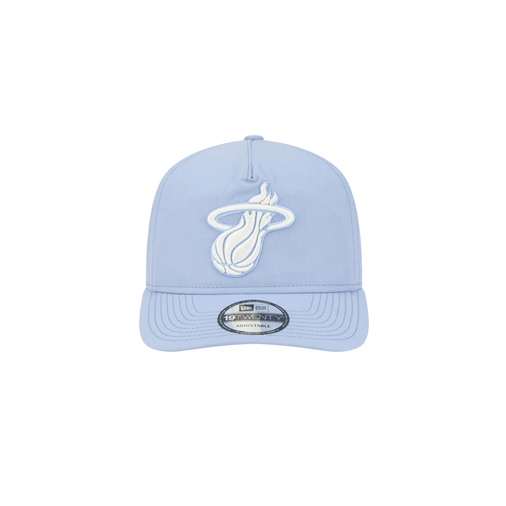 The New Era Miami HEAT Nylon Blue Snapback features a light blue cotton nylon design, pre-curved visor, white Miami Heat logo on the front, and a silver 9TWENTY Adjustable sticker on the brim, shown against a plain white background.